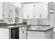 Kitchen with a large window with updated countertops, fixtures, and stainless appliances at 2078 Goldfinch Ct, Longmont, CO 80503