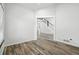 Empty room showing stairwell and a view of the foyer with lots of light at 2078 Goldfinch Ct, Longmont, CO 80503