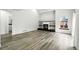 Spacious living room featuring fireplace with built-ins and wood-look flooring at 2078 Goldfinch Ct, Longmont, CO 80503