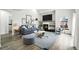 Stylish living room featuring a cozy fireplace, modern furniture, and plenty of natural light at 2078 Goldfinch Ct, Longmont, CO 80503