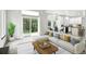 Open living space features a sectional sofa, a wooden coffee table, and a backyard view through sliding glass doors at 2078 Goldfinch Ct, Longmont, CO 80503