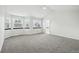 Spacious main bedroom features large windows, carpet floors, and an en-suite bathroom at 2078 Goldfinch Ct, Longmont, CO 80503