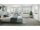 Bright main bedroom with a bay window and a sitting area for relaxation at 2078 Goldfinch Ct, Longmont, CO 80503