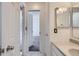 Bright bathroom with marble floors and modern sink and mirror at 7897 Allison Way # 304, Arvada, CO 80005