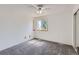 Bright bedroom with neutral carpet, a window letting in natural light, and a ceiling fan at 7897 Allison Way # 304, Arvada, CO 80005