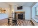 Inviting living room with fireplace, mounted television, and a window seat at 7897 Allison Way # 304, Arvada, CO 80005