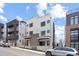 Modern two-story home featuring clean lines, neutral colors, and stylish architectural details at 1252 Yates St, Denver, CO 80204