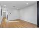 Inviting living room area with hardwood floors, recessed lighting, and a neutral color scheme at 1252 Yates St, Denver, CO 80204