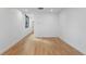 Open floor plan living room with wood floors and a large window at 1252 Yates St, Denver, CO 80204