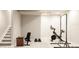 Finished basement with gym setup including bike, weights, and bench for at-home workouts at 2869 Kingston St, Denver, CO 80238