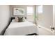 Comfortable bedroom with bright windows, neutral color scheme, and stylish decor at 2869 Kingston St, Denver, CO 80238