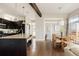 Well-lit kitchen with granite countertops, stainless steel appliances, and island seating at 2869 Kingston St, Denver, CO 80238