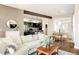 Open-concept living space showcasing hardwood floors, a dining area, and a modern kitchen at 2869 Kingston St, Denver, CO 80238
