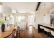 Inviting living space with a kitchen, dining area, living room and beautiful hardwood floors at 2869 Kingston St, Denver, CO 80238
