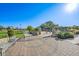 A community playground includes play equipment, seating, and decorative stone pavers at 6705 Nelson St, Arvada, CO 80004
