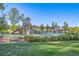 Community playground featuring a large climbing structure and slide in a well-maintained recreational area at 6705 Nelson St, Arvada, CO 80004