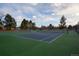 A fenced community tennis court offers residents an option for outdoor recreation at 6705 Nelson St, Arvada, CO 80004