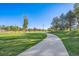 A winding walking path through a community park offers a scenic and serene experience at 6705 Nelson St, Arvada, CO 80004
