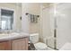 Bathroom with a glass shower, toilet, and a single sink vanity at 12832 Mayfair Way # A, Englewood, CO 80112