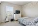 Comfortable bedroom with carpet, a large window, and a small bed at 12832 Mayfair Way # A, Englewood, CO 80112