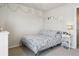 Cozy bedroom featuring carpet, a small bed, and a bedside table with a lamp at 12832 Mayfair Way # A, Englewood, CO 80112