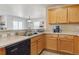 Functional kitchen featuring ample counter space, stainless steel sink, and essential appliances at 12832 Mayfair Way # A, Englewood, CO 80112