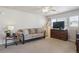 Cozy living room with a comfortable sofa, media console, and neutral color palette at 12832 Mayfair Way # A, Englewood, CO 80112