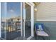 Covered patio with green siding and a sliding glass door at 12832 Mayfair Way # A, Englewood, CO 80112