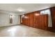 Finished basement area with wood paneling at 3045 Xanadu St, Aurora, CO 80011