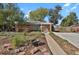 Brick ranch home with landscaped yard and a covered entryway at 3045 Xanadu St, Aurora, CO 80011