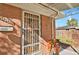 Front entrance with a security door and autumnal decor at 3045 Xanadu St, Aurora, CO 80011