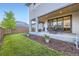 Backyard features a patio with outdoor furniture and a lush lawn at 6005 Beeler St, Denver, CO 80238