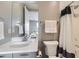 Cozy bathroom with a shower-tub combo and an adjacent storage closet at 6005 Beeler St, Denver, CO 80238