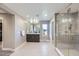 Modern bathroom featuring glass-enclosed shower, contemporary vanity, and tile flooring at 6005 Beeler St, Denver, CO 80238