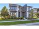 This modern home features a manicured yard with many windows at 6005 Beeler St, Denver, CO 80238