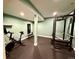 This home gym features padded floors and weights at 6005 Beeler St, Denver, CO 80238