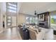 Bright living room with a modern fireplace, large windows, and contemporary furnishings with natural light at 6005 Beeler St, Denver, CO 80238