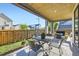 Relax on this patio featuring patio furniture and a wood ceiling at 6005 Beeler St, Denver, CO 80238