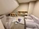 Cozy playroom nook featuring comfy chairs with personalized name embroidery and built-in shelving at 6005 Beeler St, Denver, CO 80238