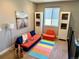 Cozy playroom featuring a colorful play area, comfy seating, and built-in shelving for books and toys at 6005 Beeler St, Denver, CO 80238