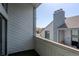 Balcony with green turf and view of a home at 14046 E Stanford Cir # I11, Aurora, CO 80015