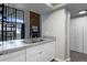 Kitchen with updated countertops leading into the living room with a fireplace at 14046 E Stanford Cir # I11, Aurora, CO 80015
