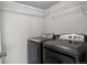 Laundry room with a gray washer and dryer at 14046 E Stanford Cir # I11, Aurora, CO 80015