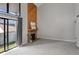 Spacious living room with a modern fireplace and sliding door to the balcony at 14046 E Stanford Cir # I11, Aurora, CO 80015