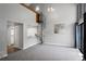 Bright living room featuring a spiral staircase, fireplace, and kitchen access at 14046 E Stanford Cir # I11, Aurora, CO 80015