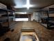 Large attic storage space with metal shelving and plywood flooring at 1421 Rustic Dr, Longmont, CO 80504
