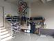 Well-organized garage featuring a shoe rack, bike rack and storage space for sporting equipment at 1421 Rustic Dr, Longmont, CO 80504