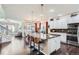 Open kitchen featuring a large center island with seating, stainless appliances and open access to living spaces at 1421 Rustic Dr, Longmont, CO 80504