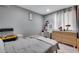 Calm bedroom featuring light-colored walls, a vanity area, and ample storage space at 5519 Tucson St, Denver, CO 80239