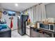 Functional kitchen with essential appliances, ample counter space, and bright natural light at 5519 Tucson St, Denver, CO 80239